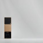 Artistic image of three SOWA Pro speakers stacked on top of each other - showing three views front, side and back.