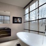 Aquavision TV with classic frame on wall of a bathroom