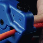 Simply45 Cable stripper head clamped over a cable prior to stripping.