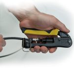 KLEIN TOOLS Heavy-Duty Multi-Connector Compression Crimper - showing someone using the crimper tool