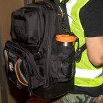 KLEIN TOOLS Tradesman Tumbler in a workers backpack.