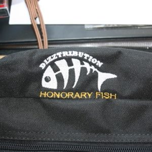 Super Rod Honorary Fish Rod Set bag showing a close up of the Dizztribution Logo embroidered onto the outside of the canvas bag