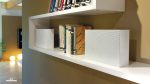 Garvan Coro Bookshelf speaker KB213 showing two white speakers with white grill covers on a bookshelf alongside some books