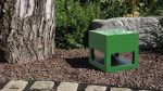 Garvan Loto Outdoor 360 Case Speaker SA117 in green shown in a garden