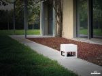 Garvan Loto Outdoor 360 Case Speaker SA117 in white shown in a garden