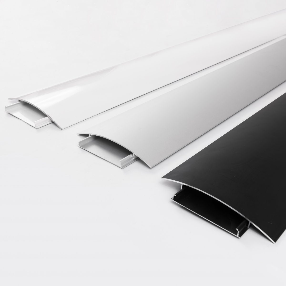 BOSSCOM Cable Covers 200mm showing three colours: black, aluminium and white shown from the side.