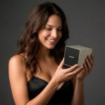 Person holding a Garvan KW110 speaker to show comparative size of the speaker.